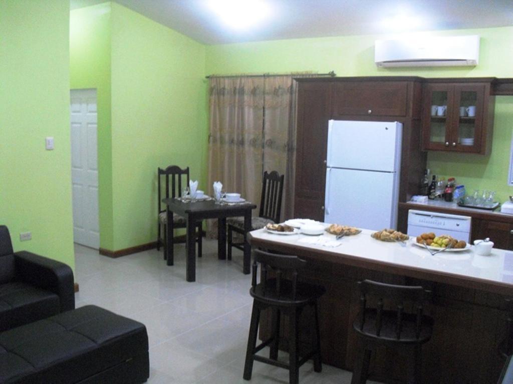 Piarco Village Suites Bagian luar foto