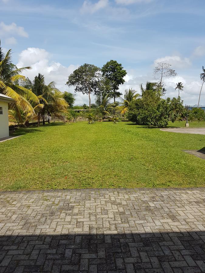 Piarco Village Suites Bagian luar foto
