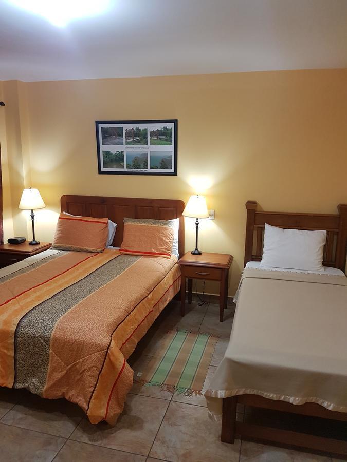 Piarco Village Suites Bagian luar foto