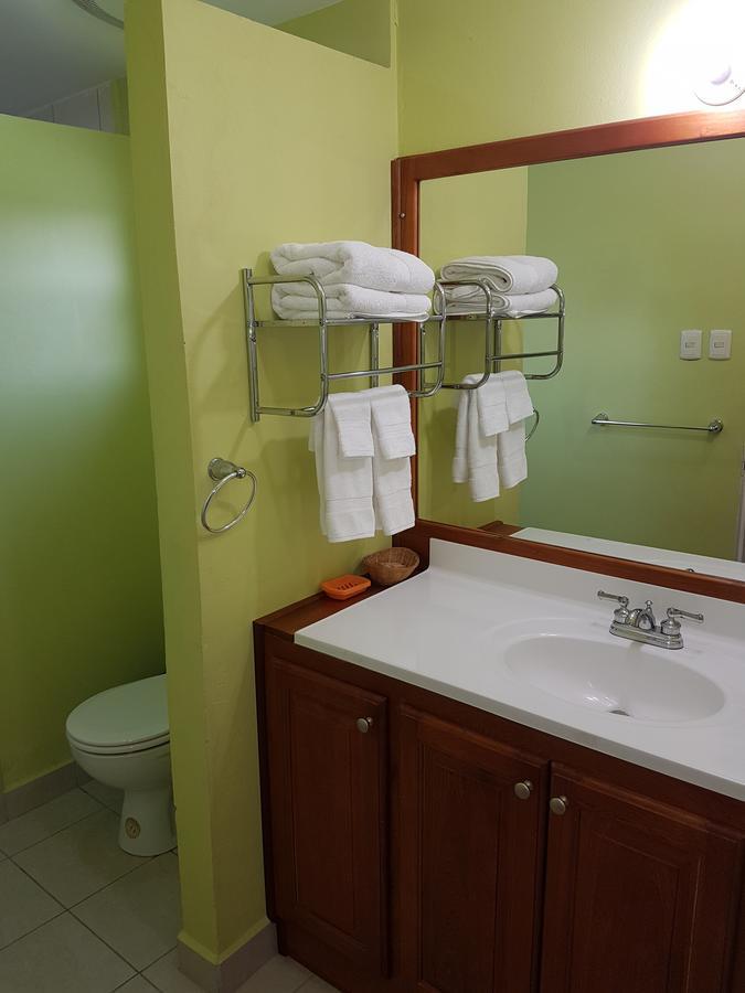 Piarco Village Suites Bagian luar foto